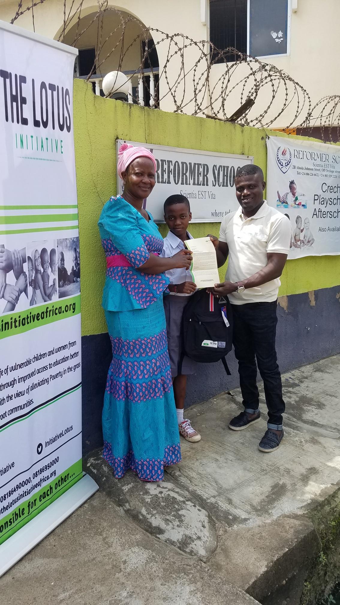 Lotus Initiative Manager with Master Samuel Kareem with his Mother.