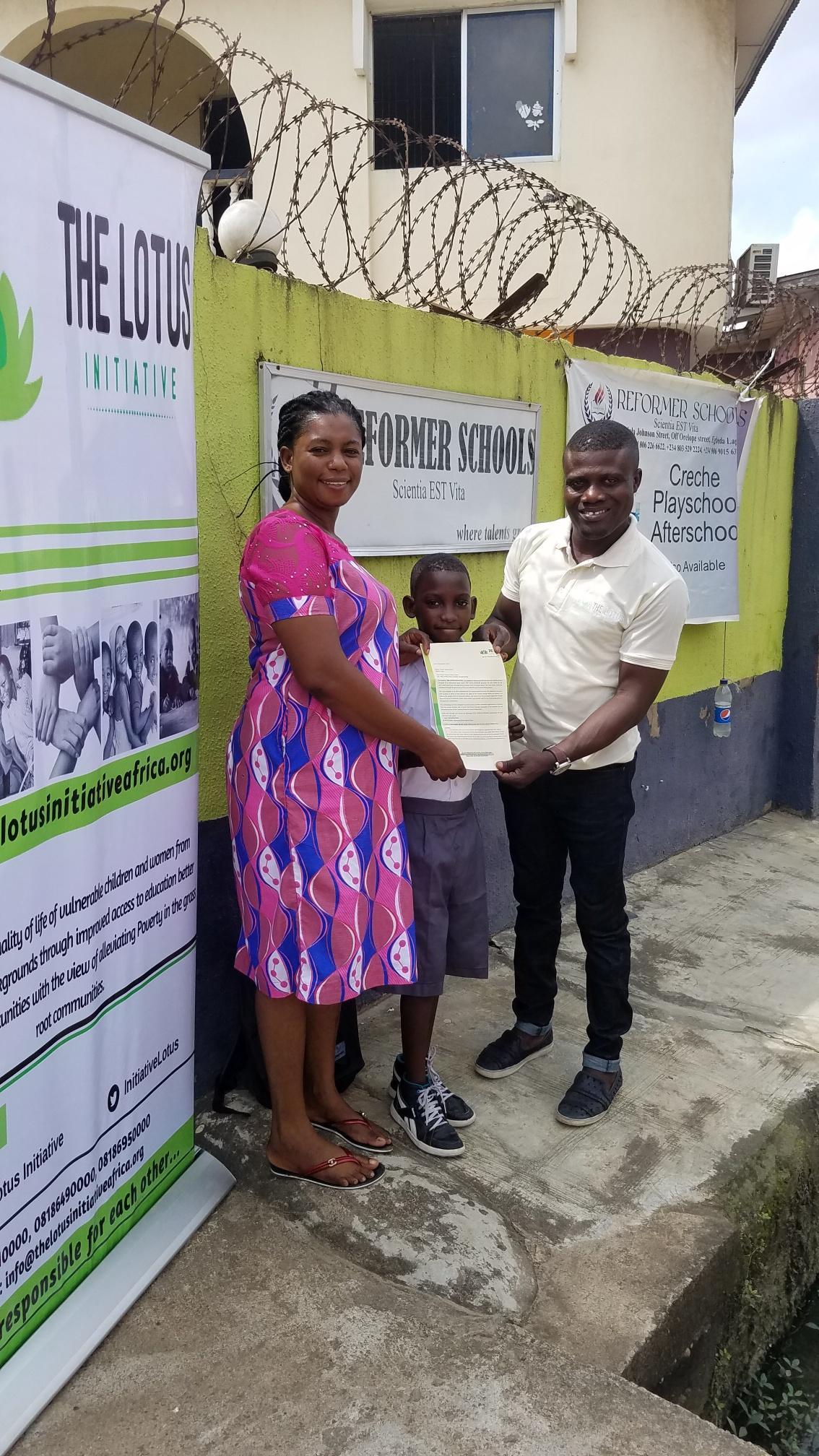 Lotus Initiative Program Manager with Master Samuel Adams with his Mother.