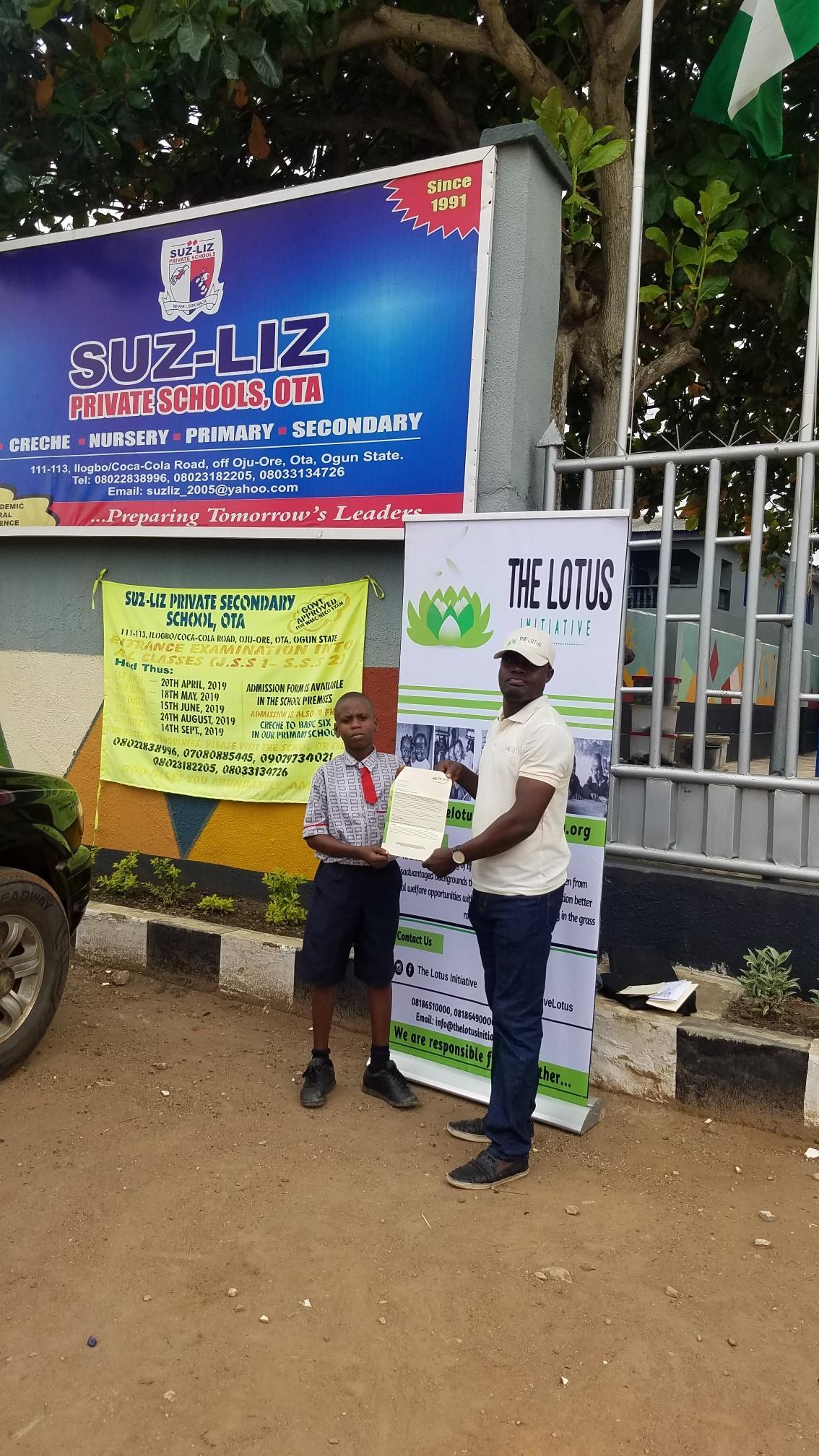 Presentation of Scholarship letter to Master Daniel Eyitayo.