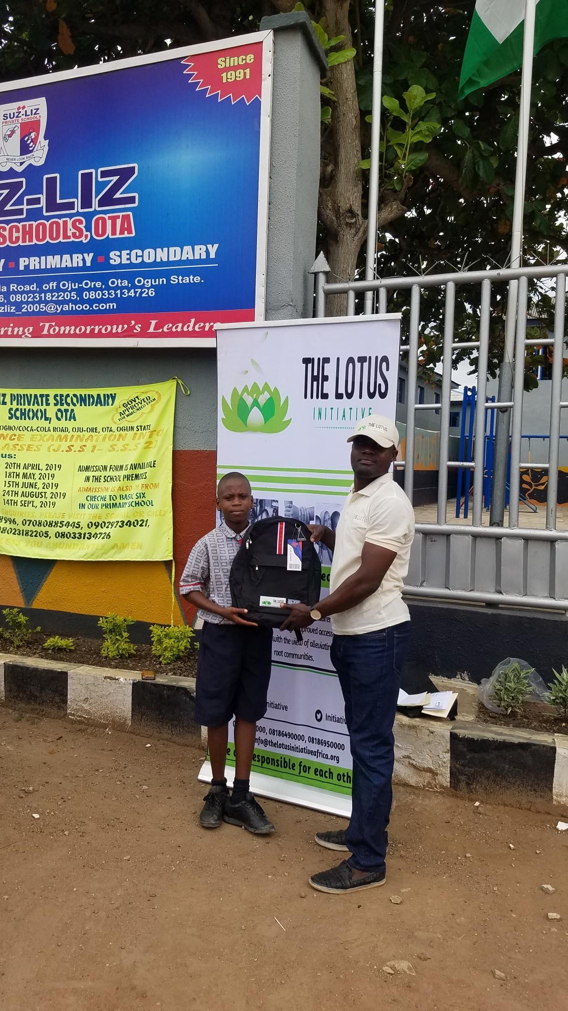 Lotus Initiative Program Manager with Lotus scholar Daniel Eyitayo of Suz-Liz Group of Schools, Otta.