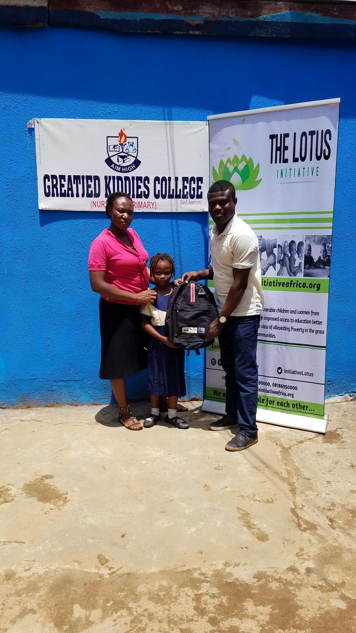 Lotus Program Manager with Lotus Scholar Kolapo Popoola and staff of Greatied Kiddies College.