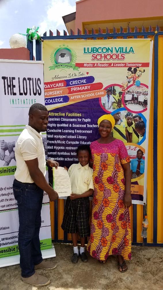 Presentation of scholarship letter to Imoleayo Alaka with his mum.